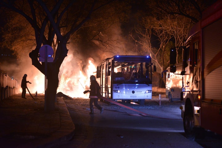 Firefighters attempt to extinguish flames following an explosion in Ankara.