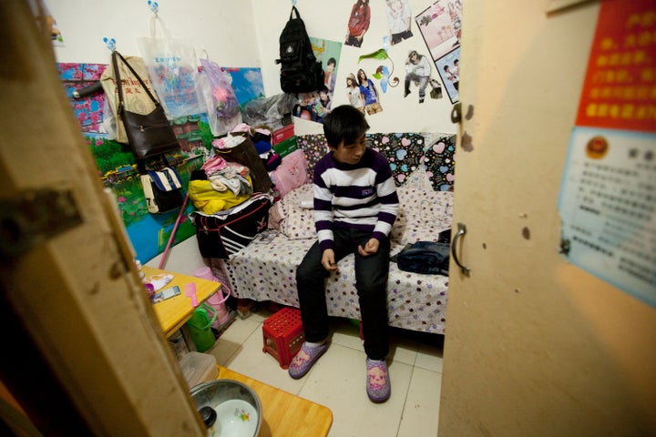 A man sits inside his apartment inside a Chinese air defense bunker on the outskirts of Beijing, China, on Friday, Feb. 11, 2011.