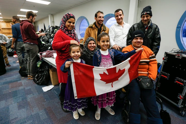 A Syrian refugee family arrives in Toronto. Canada vowed to resettle 25,000 Syrian refugees by the end of February, and the U.S. pledged to resettle 10,000 by September.