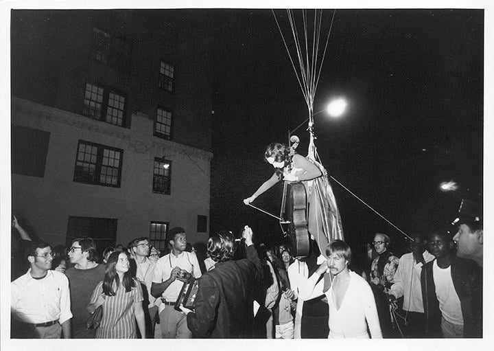 Peter Moore. Charlotte Moorman performs Jim McWilliams’s <em>Sky Kiss</em>, 6th Annual New York Avant Garde Festival, Central Park West, September14, 1968. Photograph © Barbara Moore/Licensed by VAGA, NY.