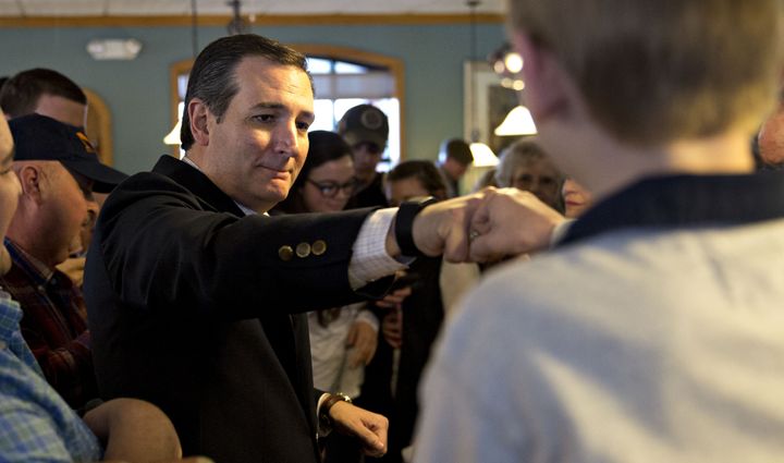 See Ted Cruz fist-bump another person during a campaign stop in Seneca, South Carolina.