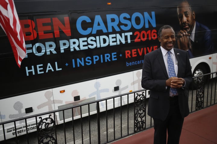 Ben Carson, retired neurosurgeon and 2016 Republican presidential candidate, smiles while speaking to a reporter during a campaign stop on primary election day at The Beacon Drive-In in Spartanburg, South Carolina, U.S., on Saturday, Feb. 20, 2016.