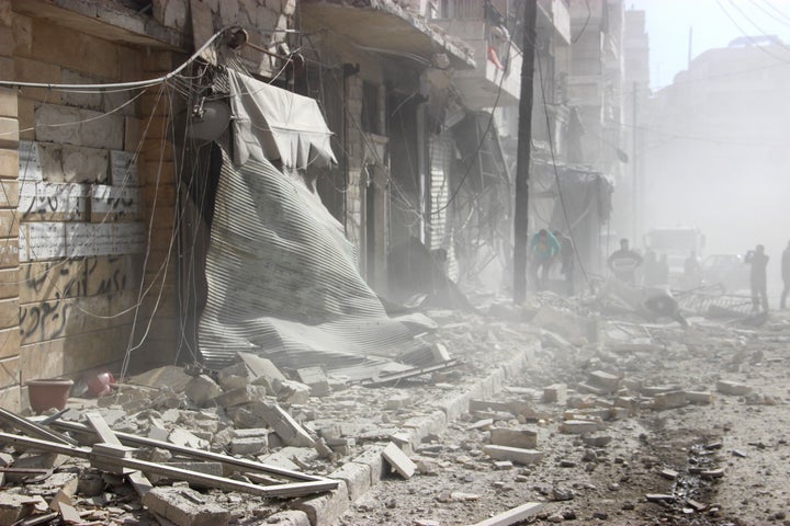 Debris is seen following Russian airstrikes on a residential area in Aleppo, Syria. The United States and Russia drafted a plan calling for a ceasefire in Syria, which would begin on Saturday.