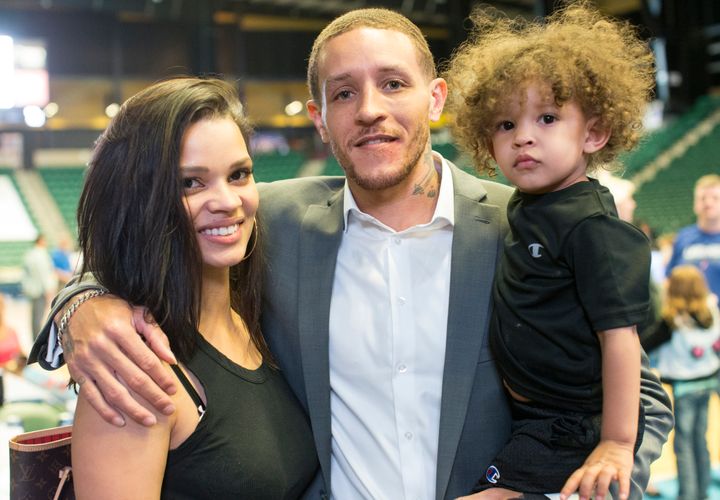 Delonte West with his wife Caressa and son Cash posed for a photo at the Dr. Pepper Arena in Frisco, Texas.