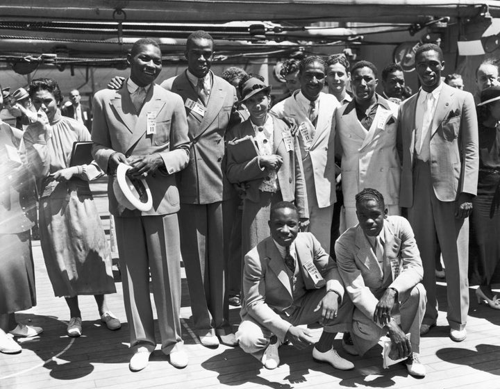 Left to right rear: Dave Albritton and Cornelius Johnson, record high jumpers; Tidye Pickett, track star; Ralph Metcalfe, sprinter; Jimmy Clark, boxer; Matthew "Mack" Robinson, sprinter. In front are John Terry (left), weight lifter and John Brooks, broadjumper.