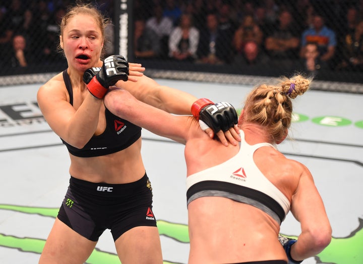 Holly Holm punches Ronda Rousey during the UFC 193 event at Etihad Stadium on Nov. 15, 2015, in Melbourne, Australia.