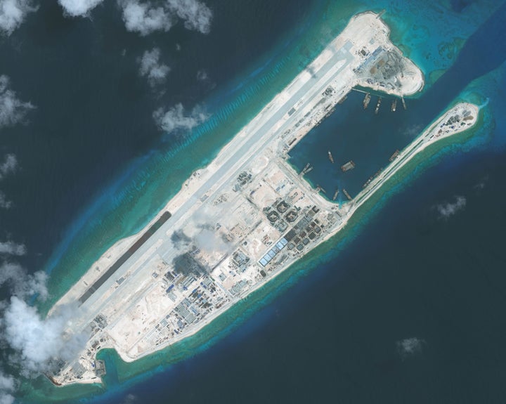 Several of the South China Sea's disputing countries, most notably China, have artificially constructed or expanded islands because creating new land and building on them allows them to lay claims to more territory. Satellite imagery shows Fiery Cross Reef, which is an island China is building on.