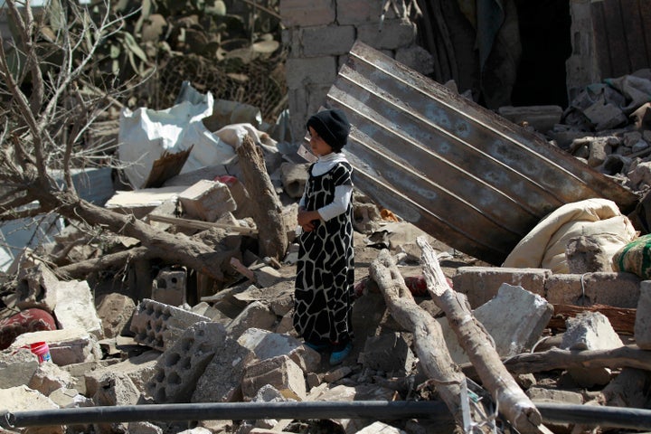 Almost 6,000 people -- almost half of them civilians -- have been killed since Saudi-led forces entered the Yemen conflict. Here, a boy stands in the rubble of buildings destroyed by airstrikes in Sanaa.