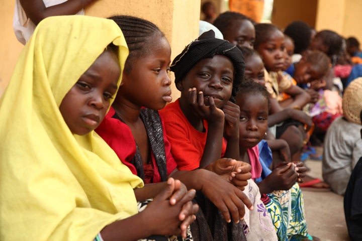 Girls rescued by Nigerian soldiers from Boko Haram sit at the Malkohi refugee camp on May 5, 2015. They were among a group of 275 people rescued by the Nigerian military and arrived at the camp on May 2.