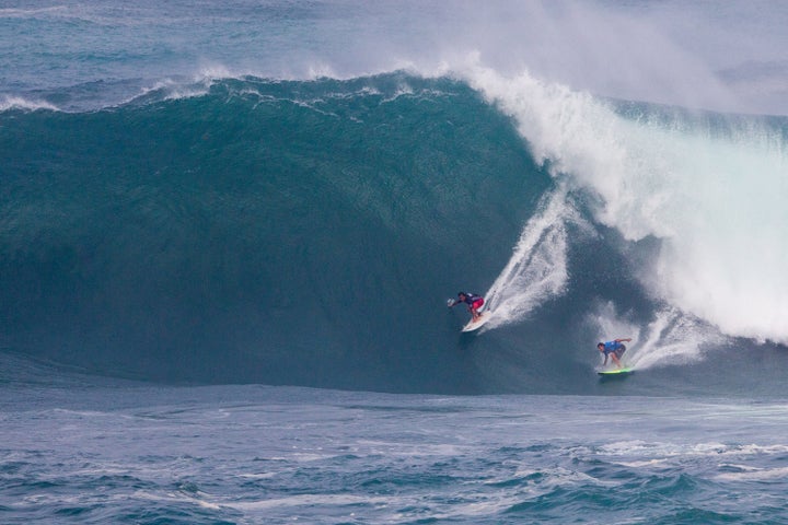 Ross Clark Jones and Jamie Mitchell surf in "The Eddie."