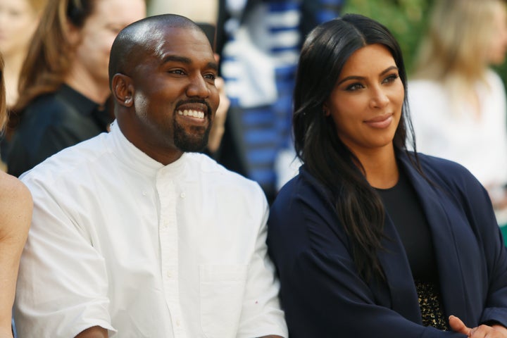 Recording artist Kanye West (L) and TV personality Kim Kardashian attend CFDA/Vogue Fashion Fund Show and Tea at Chateau Marm