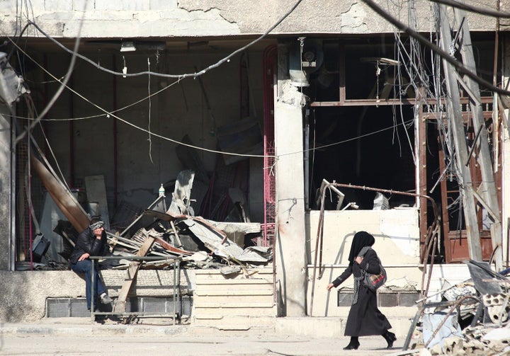 Syria Deeply speaks to Salameh, an activist and journalist in Damascus dedicated to covering her country's human rights issues. She risks detention and being "disappeared" by the government. A woman walks along a street in Damascus.