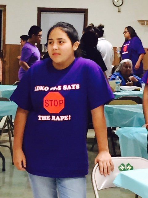 Young woman participating in a Take Back The Night walk on the Yankton Sioux Reservation in South Dakota.