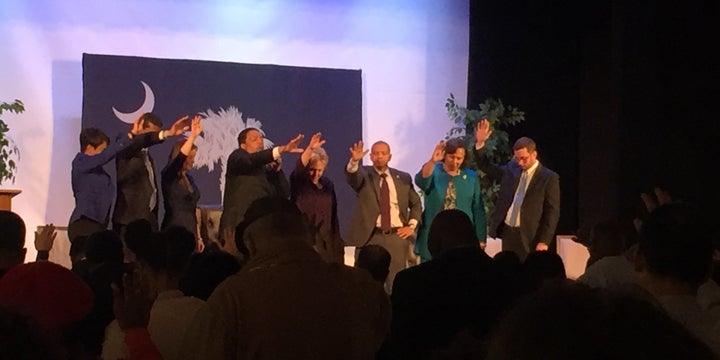 A town hall in North Charleston, South Carolina with Democratic presidential candidate Hillary Clinton ended in prayer Thursday evening. 