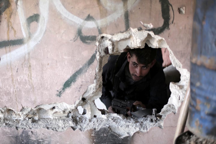 Nusra Front has made alliances with several rebel groups, making its locations harder to pinpoint. Here, a Syrian opposition fighter is pictured in Syrian town on Arbin on Friday. 