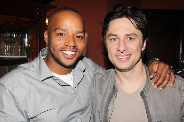 Donald Faison and Zach Braff (co-stars from the television show 'Scrubs') pose backstage at the hit musical 'Bullets Over Broadway' on Broadway at The St. James Theater on July 15, 2014 in New York City.