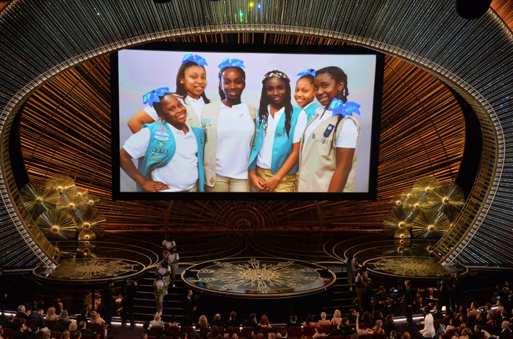 Chris Rock's daughters and Girl Scouts troop are seen on a screen on stage at the 88th Oscars on February 28, 2016 in Hollywood, California.