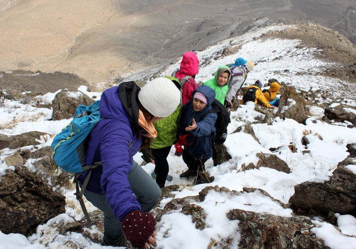 Afghan women and girls, all part of an organization called Ascend, hike to the top of a mountain in Kabul, Afghanistan, on a sunny morning in January. 