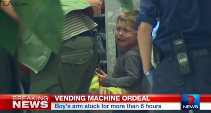 A 4-year-old boy's arm became trapped inside of a vending machine for six hours on Sunday.