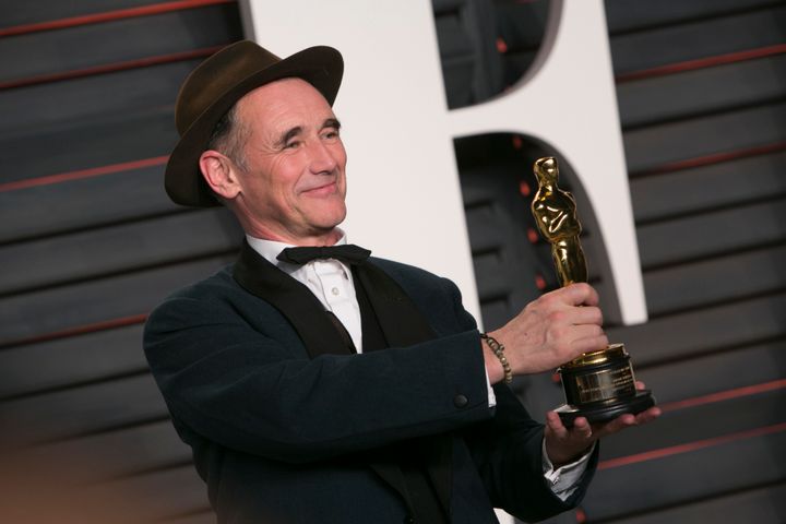 Mark Rylance holds his Oscar for Best Supporting Actor for his role in "Bridge of Spies" as he arrives to the 2016 Vanity Fair Oscar Party.