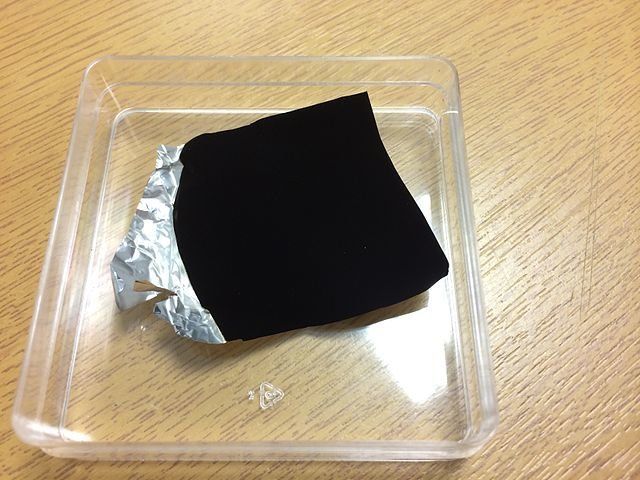 The material is so dark it makes crinkled aluminum foil appear flat. Photo: Wikimedia Commons.