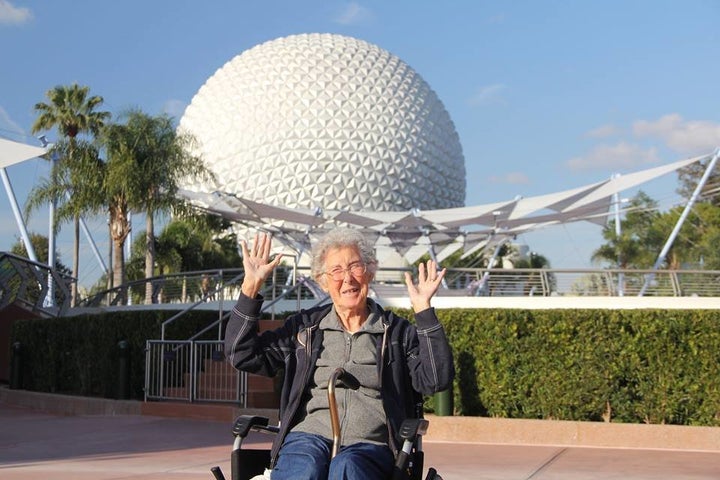 Norma posing in front of Epcot at Disney World.