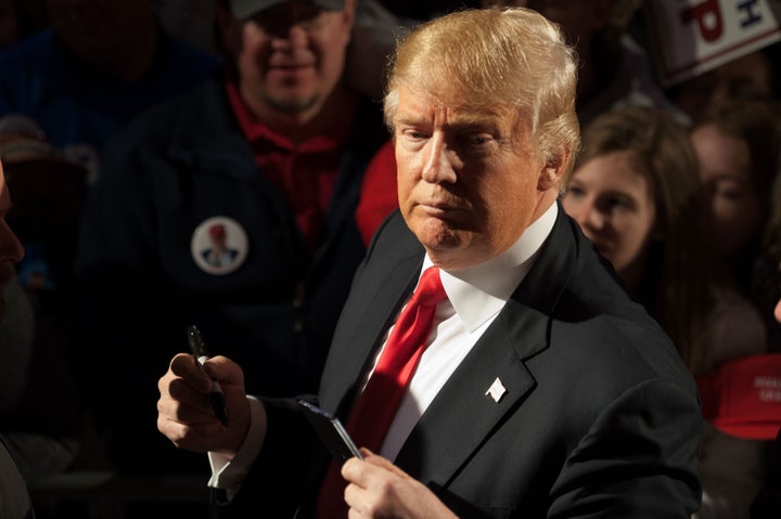 Republican presidential candidate Donald Trump signs autographs for supporters at the conclusion of a rally at Millington Regional Jetport on February 27, 2016 in Millington, Tennessee.