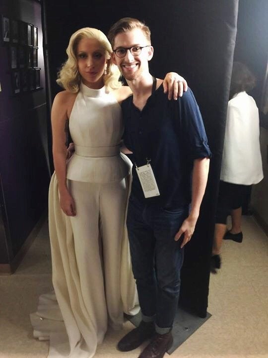 Andrew Brown poses backstage with Lady Gaga at the Oscars.
