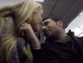 The couple shared a kiss after the news was announced over the airplane's intercom.