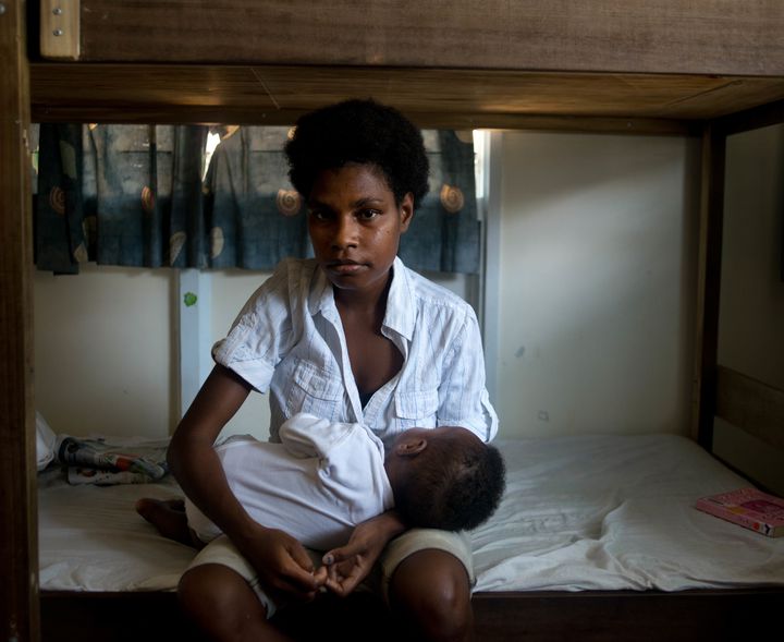 Divorces are possible but very complicated, Aoife Ní Mhurchú says. A woman and her daughter rest at a safe house in Port Moresby, Papua New Guinea.