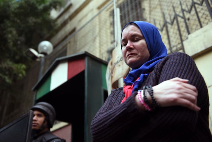 A woman takes part in a rally in memory of Giulio Regeni outside of the Italian embassy in Cairo. Regeni's death has put