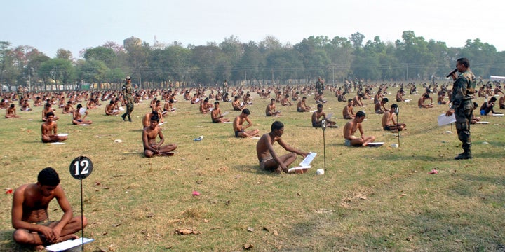 Indian armed forces and their families members perform Yoga on the