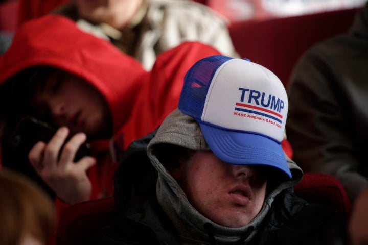 A man sleeps before a campaign event for Republican presidential candidate Donald Trump on Jan. 23, 2016, in Pella, Iowa.