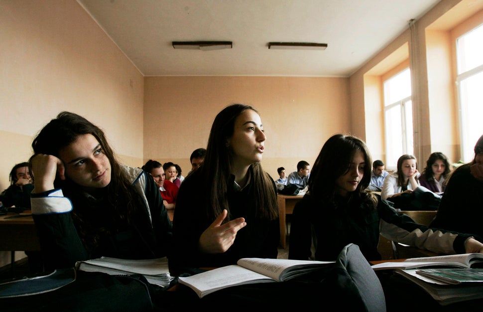 A Kosovo Albanian girl answers a question in a sociology class at Sami Frasheri high school in Pristina, March 2007. (At the 