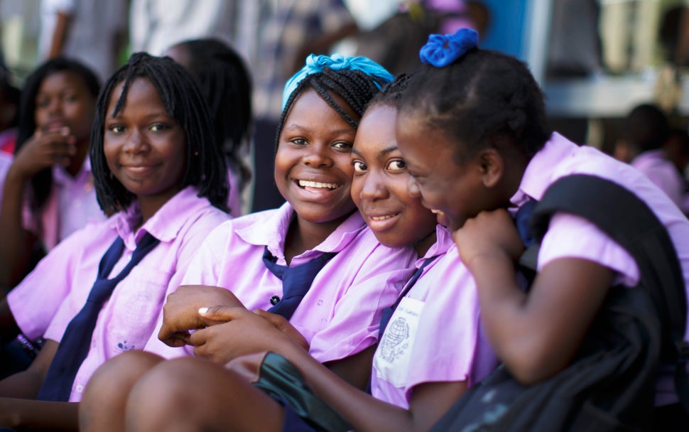 Students in school uniforms pose for a photo on September 29, 2015 in Beira, Mozambique.