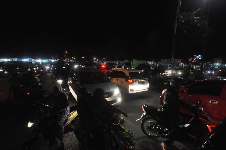 There were no immediate reports of damage, but the shallower a quake, the more dangerous it is. Indonesian residents use a variety of transport options as they rush to higher ground in Padang late March 2, 2016. 