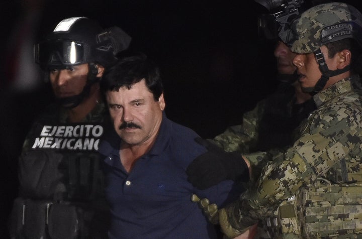 Drug lord Joaquín "El Chapo" Guzmán Loera is escorted to a helicopter at Mexico's City's airport on Jan. 8, 2016, after his recapture. Guzmán's attorney says his client's treatment after returning to prison has been so harsh that he now wants to return to the United States.