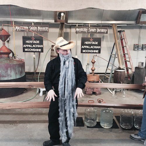 Vann McCoy, owner and master distiller at Mayberry Spirits in Mount Airy, North Carolina, teaches visitors about Appalachian culture and the distilling process.