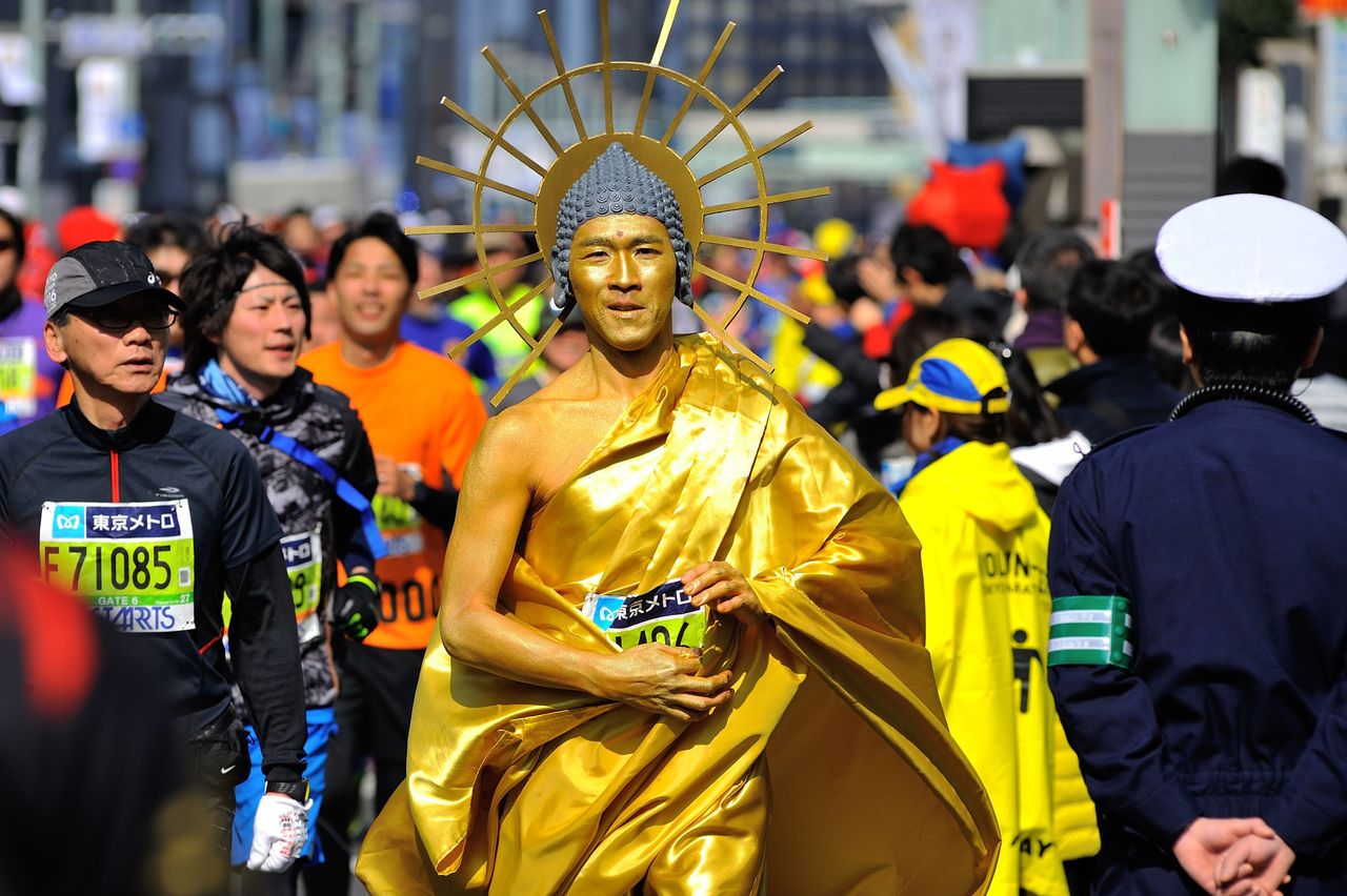 Runners cross Tokyo city as they compete in the Tokyo Marathon on February 28, 2016 in Tokyo, Japan.