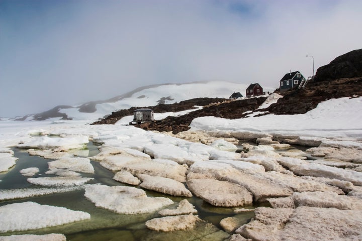 Dirty sea ice breaking up in Kulusuk, Greenland.