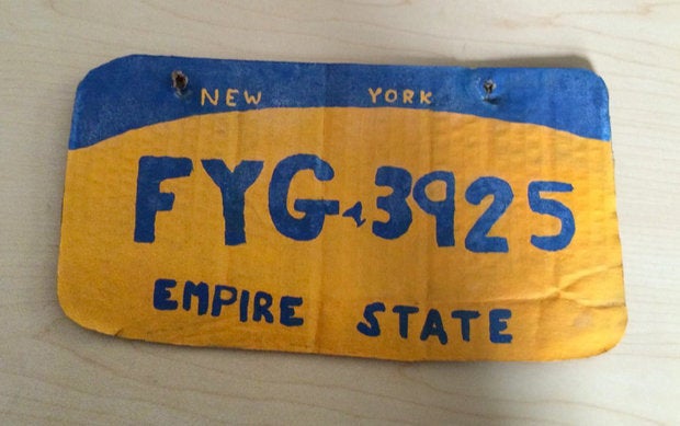 A New York woman was caught driving with this homemade license plate on the back of her vehicle. 