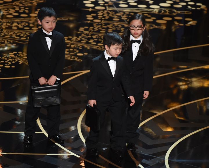 Children represent accountants from PricewaterhouseCoopers on stage at the 88th Oscars on February 28, 2016 in Hollywood, California. 