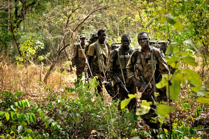 Following military setbacks, the LRA may be trying to refill its ranks with child soldiers, The Resolve's Paul Ronan said. Here, Ugandan soldiers patrol the central African jungle looking for Joseph Kony in 2012.