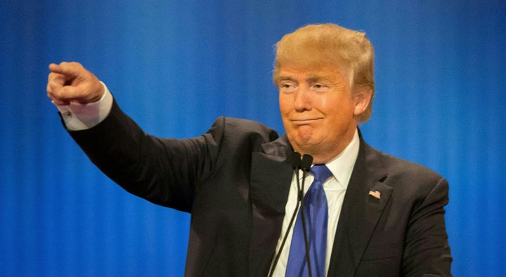 Republican Presidential candidate Donald Trump acknowledges his supporters during the Republican Presidential Debate in Detroit, Michigan, March 3, 2016.