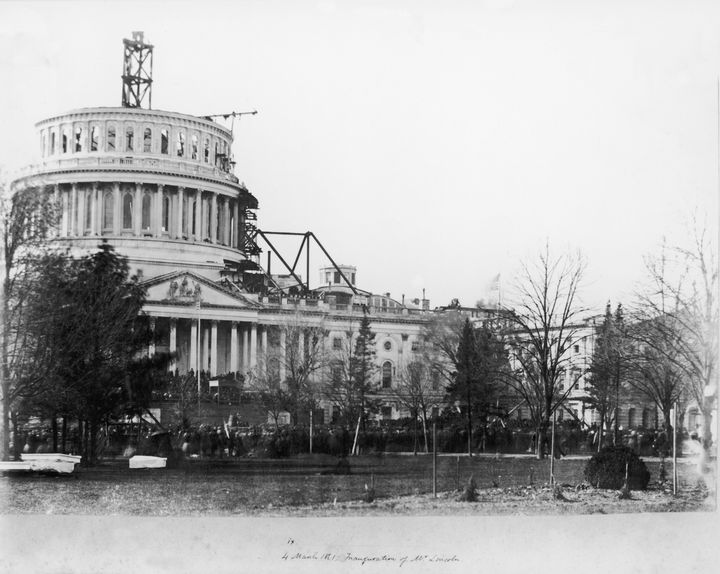 A view of the United States Capitol Building, showing the dome under construction, on the day of the first inauguration of President Abraham Lincoln.