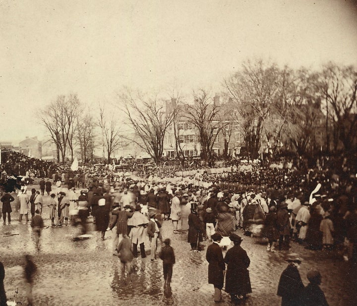 A crowd of people waiting during President Abraham Lincoln's second inauguration, which was held on a rainy day at the U.S. Capitol grounds.