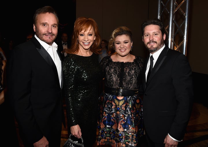 Happier times: Narvel Blackstock and Reba McEntire attend Muhammad Ali's Celebrity Fight Night XXI with Kelly Clarkson and Brandon Blackstock in 2014.