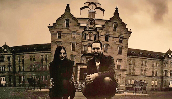 "Paranormal Lockdown" investigators Katrina Weidman and Nick Groff in front of the abandoned Trans-Allegheny Lunatic Asylum in Weston, West Virginia, where they attempt to "talk" to spirits.