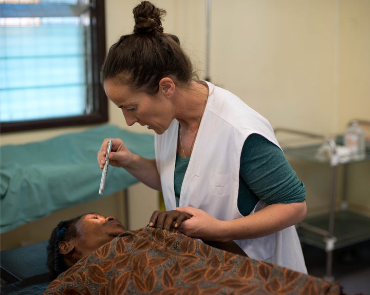 Aoife Ní Mhurchú treats a patient at Tari Hospital, Papua New Guinea. She sees several cases of family and sexual violence every day.