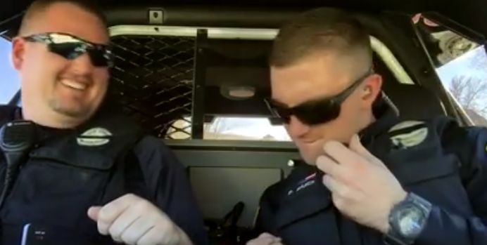The clip of the Palisade Police Department officers is going viral, and by Sunday morning had racked up more than 800,000 views.